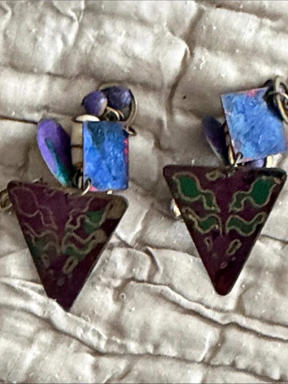 Clip style earrings artist made abstract metal pieces with attached panels